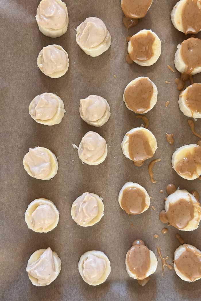 bananas sliced with yogurt and peanut butter on top